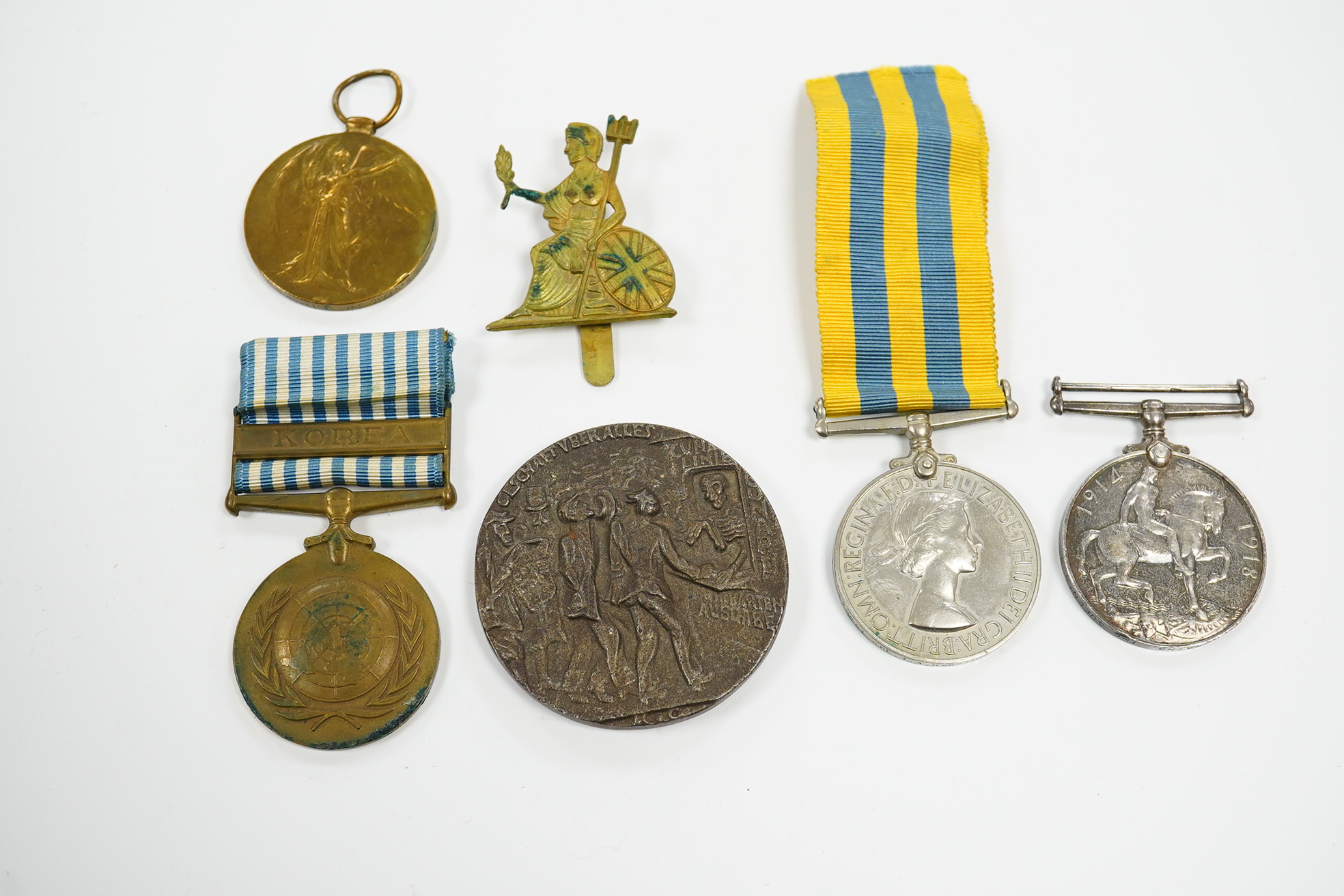 A First World War medal pair awarded to SJT. F.C. Howkins, The Queen’s R., together with a QEII Korea medal pair awarded to CPL. T.A. Howkins, R. Norfolk, plus a Lusitania propaganda medallion, all contained in a Princes